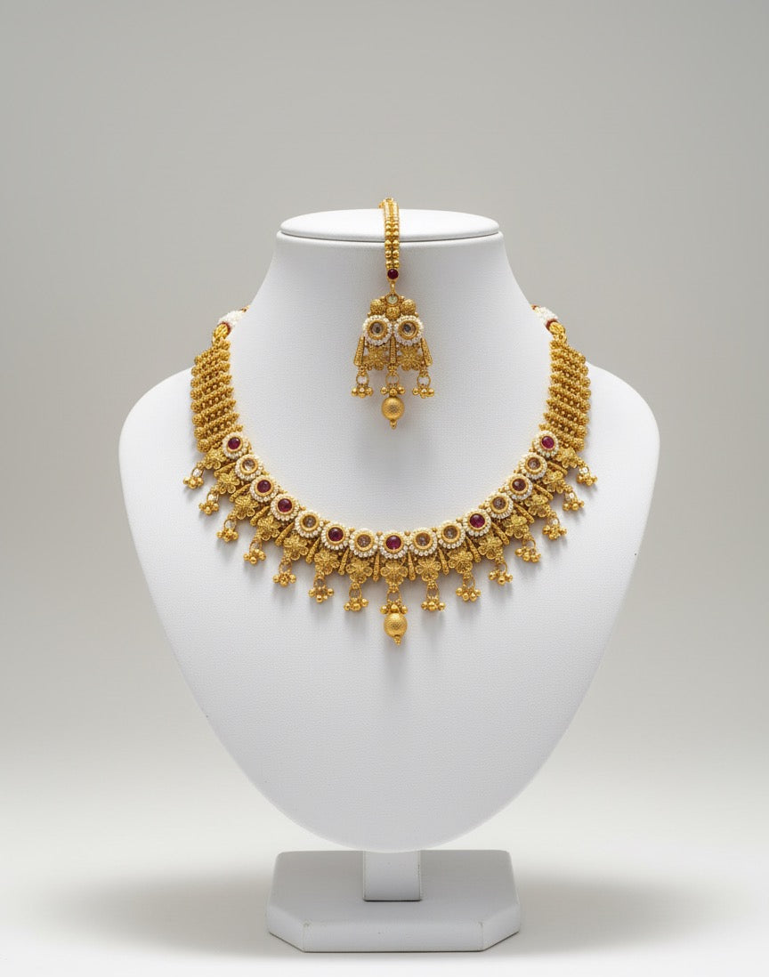 Gold-Plated Necklace, Jhumka Earrings & Maang Tikka Set – Traditional Red & White Stone Design with Pearl Detailing