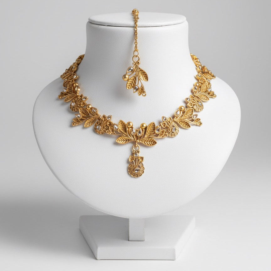 Gold-Plated Necklace, Earrings & Maang Tikka Set – Leaf Design with Stone Detailing and Elegant Finish