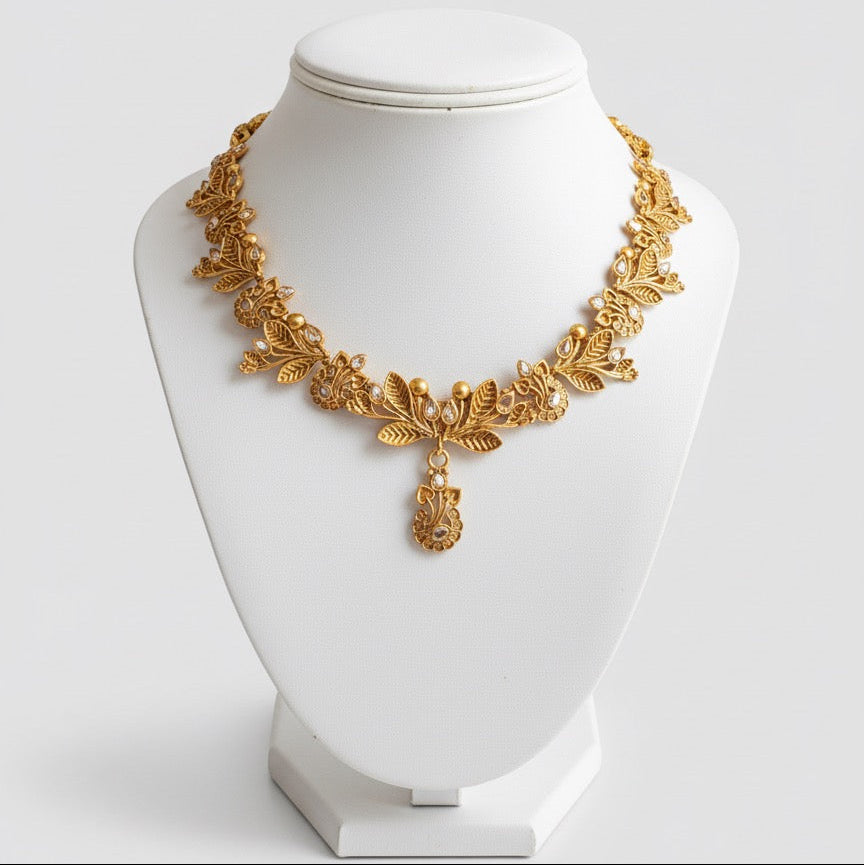 Gold-Plated Necklace, Earrings & Maang Tikka Set – Leaf Design with Stone Detailing and Elegant Finish